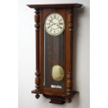 Victorian walnut Vienna style wall clock, Roman dial with twin train movement and brass pendulum,