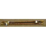 Three medium wood and gilt circular curtain poles with arrow finials,