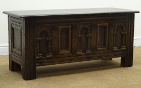 Old Charm oak chest, hinged moulded lid, three panel carved front, stile supports, W115cm, H52cm,