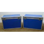 Pair of flight cases, hinged lid with clasps, two side and one extending handle, two side wheels,