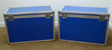 Pair of flight cases, hinged lid with clasps, two side and one extending handle, two side wheels,