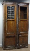 Edwardian oak cupboard, projecting cornice, lead glazed panelled doors, plinth base, W115cm, H213cm,