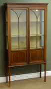 Edwardian inlaid mahogany display cabinet, two astragal glazed doors enclosing two fitted shelves,