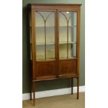 Edwardian inlaid mahogany display cabinet, two astragal glazed doors enclosing two fitted shelves,