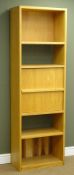 Oak finish bookcase/workstation, four open shelves, fall front enclosing fitted interior, W60cm,