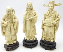 Three Chinese Ivory style resin models of three Sages,