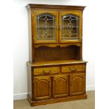 Early 20th century style oak finish dresser, projecting cornice above two glazed doors, two drawres,