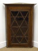 19th century oak hanging corner cupboard, projecting cornice,