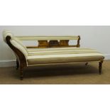 Edwardian walnut framed chaise longue, upholstered in a striped beige fabric,