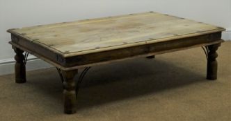 Rectangular eastern hardwood coffee table, moulded top, metal studs and strap work corners,