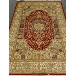 Keshan red ground carpet, central medallion, floral field, repeating border,