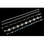 Five silver stone set bracelets,