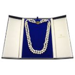 Double strand cultured pearl necklace by Mikimoto, with gold sapphire clasp stamped 9ct,