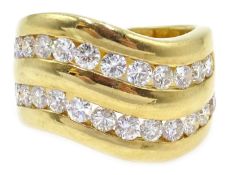 18ct gold diamond double channel ring, wave design stamped 750 Condition Report 13.