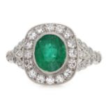 Platinum (tested) oval emerald and diamond ring,