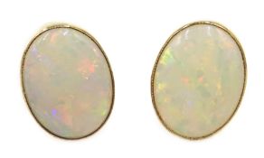 Pair of 9ct gold opal stud earrings, hallmarked Condition Report Approx 1.3gm, 1.