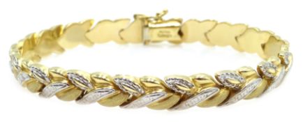 White and yellow gold leaf design bracelet, stamped AU14K Condition Report Approx 8.