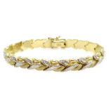 White and yellow gold leaf design bracelet, stamped AU14K Condition Report Approx 8.