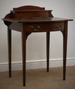 Edwardian mahogany writing table, raised shaped back, and hinged pen compartment, inset leather top,