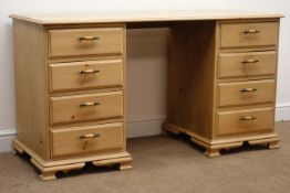 Solid pine twin pedestal desk, eight graduating drawers on shaped bracket supports, W140cm, H76cm,