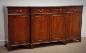 Georgian style cross banded mahogany breakfront sideboard, four drawers and four cupboards,