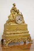 Late 19th century French gilt metal figural mantel clock with seated female figure and circular