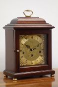 Comitti of London mahogany cased bracket clock, square brass dial with silvered Roman chapter,