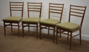 Set four teak Meredew Furniture dining chairs, upholstered seats on turned tapering supports,