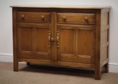 Ercol side cabinet, two drawers above two panelled cupboard doors, on stile supports, W123cm, H84cm,