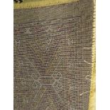 Bokhara green ground carpet, geometric patterned field, repeating border,
