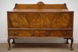 Early 20th century walnut sideboard, shaped raised carved back, three cupboards and two drawers,