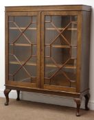 Early 20th century oak display cabinet, astragal glazed doors enclosing three adjustable shelves,