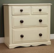 Painted and waxed pine chest of two short and two long drawers, turned mahogany handles,