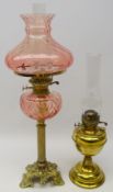 Cast brass reeded oil lamp with glass shade and reservoir H69cm and another brass oil lamp (2)