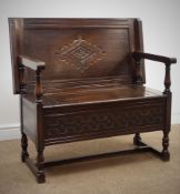 Reproduction carved oak monks bench, hinged seat,