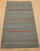 Kilim blue ground rug, red and beige striped field,