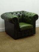 Chesterfield armchair upholstered in deeply buttoned green leather,