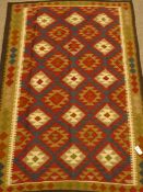 Maimana Kelim red and brown rug,