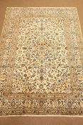 Kashan beige and ground rug, central medallion, floral field with repeating border,