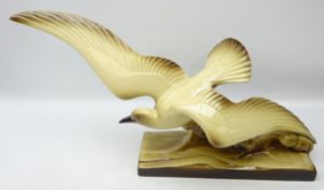 Art Deco pottery model of a seagull riding a wave,