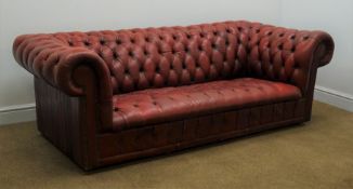 Vintage Chesterfield three seat sofa, upholstered in deeply buttoned oxblood red leather,