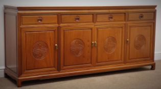 Chinese rosewood sideboard, four drawers and four cupboard doors with geometric detailing,