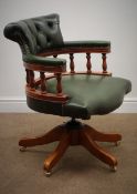 Reproduction swivel office captains chair upholstered in buttoned green leather (W62cm)