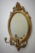 19th centruy gilt framed girandole mirror, oval plate with three candle branches, W44cm,