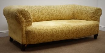Late 19th century two seat Chesterfield type settee, upholstered in a gold floral pattern fabric,