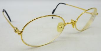 Cartier gold tone glasses, marked '5321' and '140 Made in France CE 2010417',