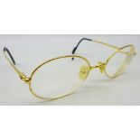 Cartier gold tone glasses, marked '5321' and '140 Made in France CE 2010417',