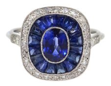 Platinum (tested) ring set with central oval sapphire,