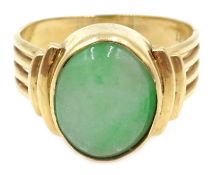 Gold oval cabochon jade ring, stamped 18K Condition Report Approx 7.