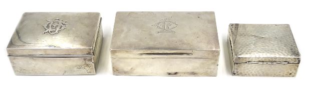 Two Victorian silver cigarette boxes by Walter Raymond and Goldsmiths & Silversmiths Co,